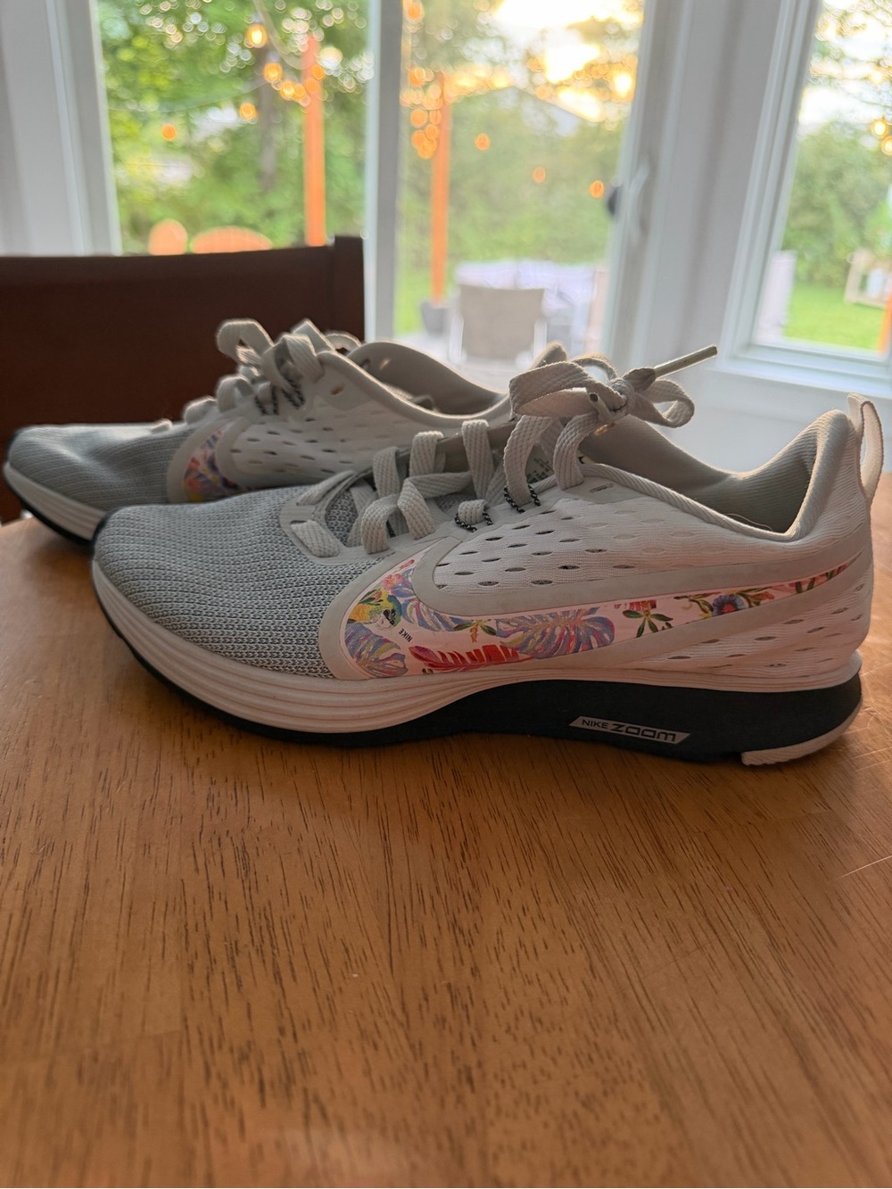Nike Women's Light Gray Running Sneakers with Floral Swoosh